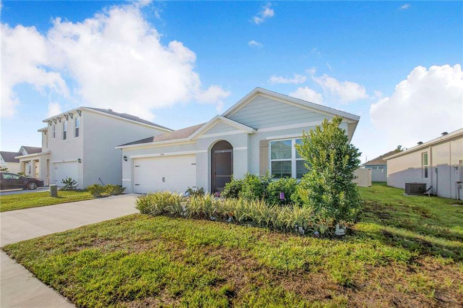 Front exterior of a new home in Bradbury Creek, Haines City, FL, highlighting curb appeal (Image 23).