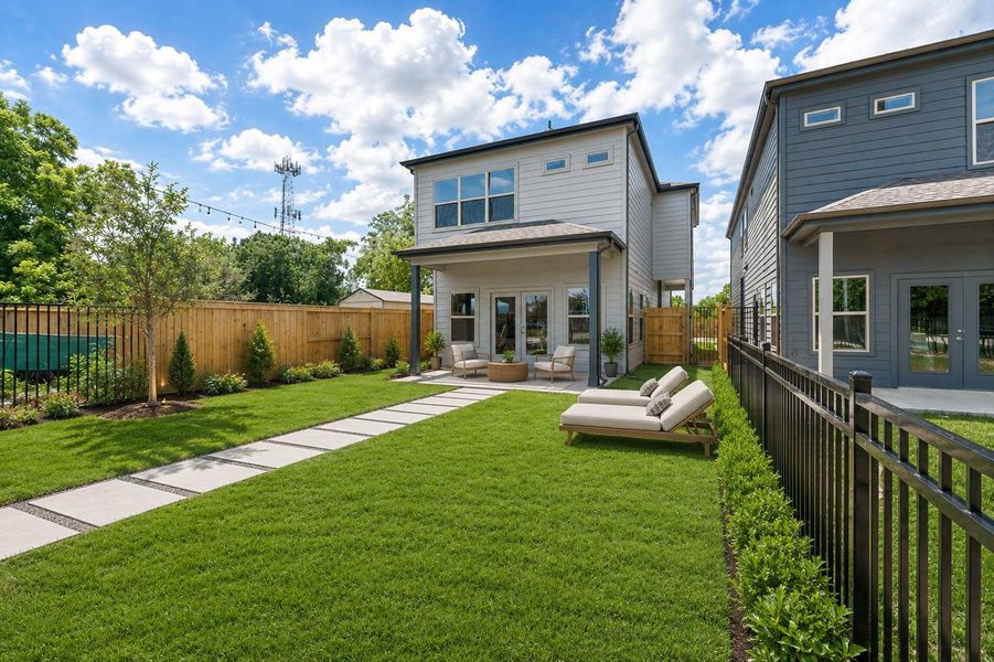 Spacious backyard with covered patio, ideal for entertaining, relaxing, or everyday outdoor living.