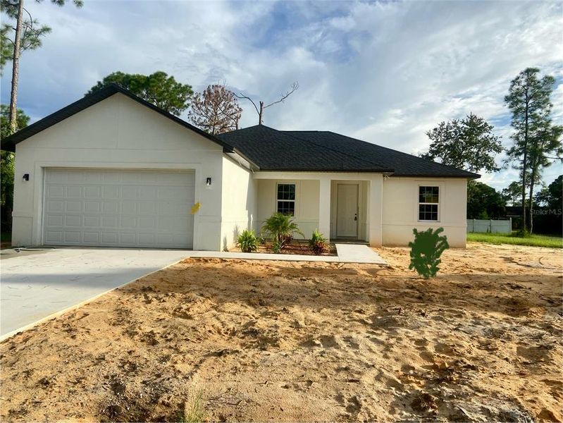 Front exterior of a new home in , Sebring, FL, highlighting curb appeal (Image 1).