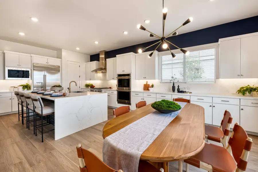 Representative furnished interior of a home built from the Tipton Plan 3507 by Tri Pointe Homes in Waterston Central, Gilbert (Image 9).