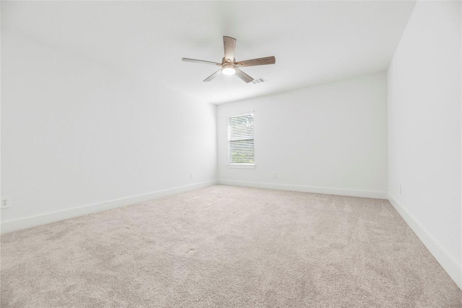 All upstairs secondary bedrooms offer plush carpet, ceiling fans and large closets.