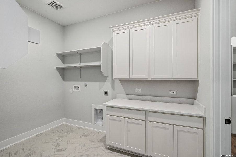 Furnished interior view inside a new home in Potranco Oaks, Castroville (Image 12).