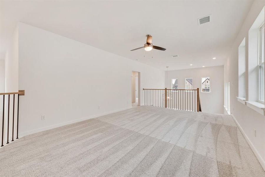 Empty room with carpet and recessed lighting Empty room with carpet and recessed lighting