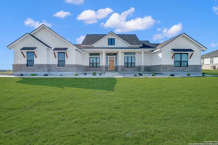 Front exterior of a new home in , La Vernia, TX, highlighting curb appeal (Image 30).