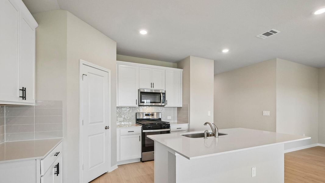 Furnished interior view inside a new home in Carillon, Manor (Image 7).
