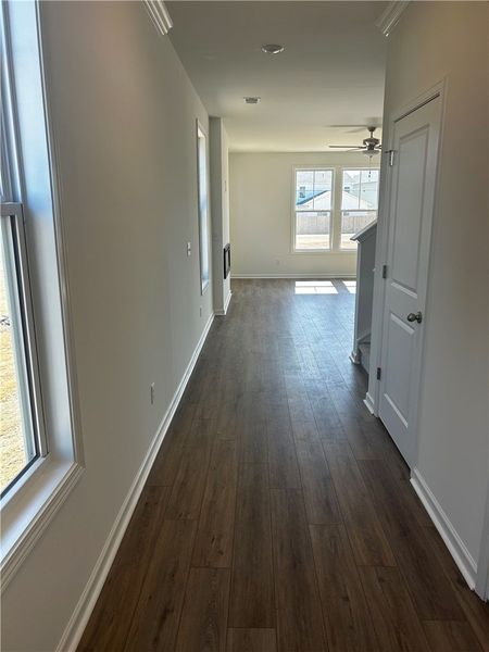 This inviting hallway offers a warm welcome, leadi