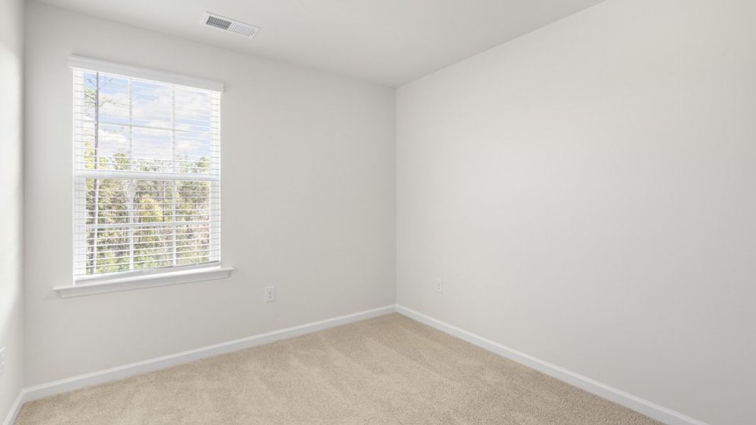 Spacious, unfurnished interior of a new home in The Townes at Galvins Ridge, Sanford (Image 23).