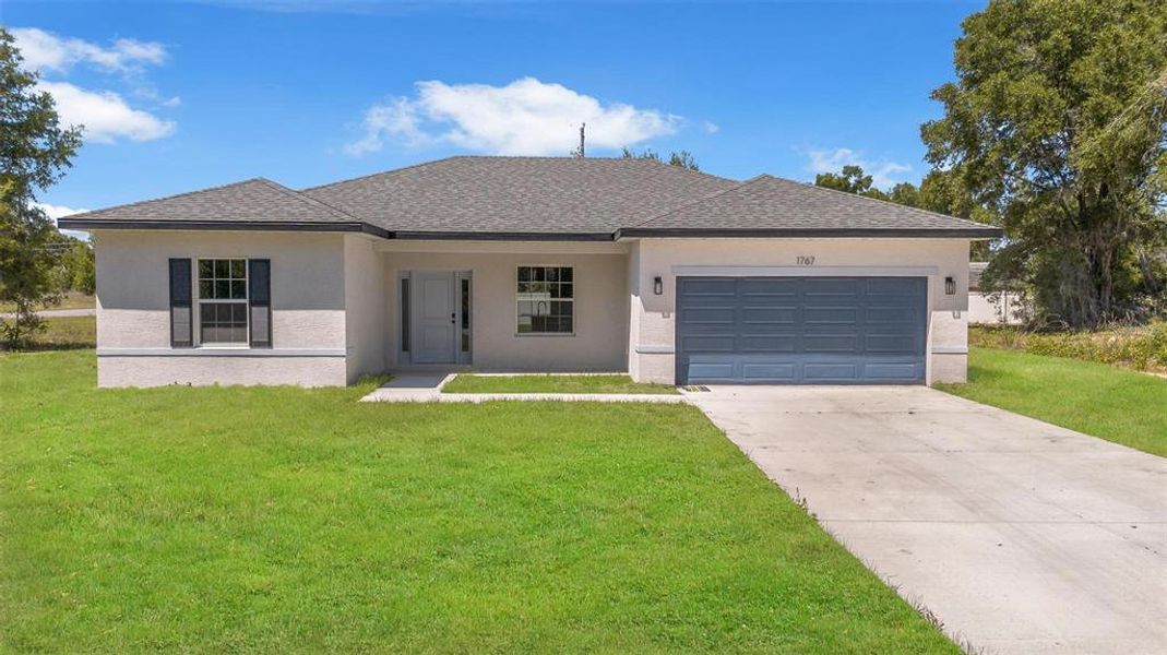 Front exterior of a new home in , Ocala, FL, highlighting curb appeal (Image 27).