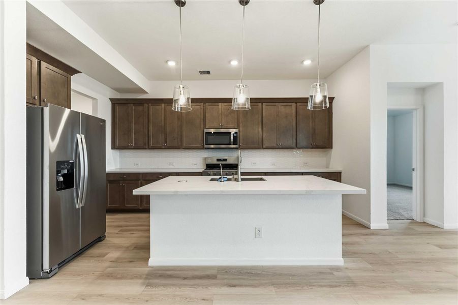 Furnished interior view inside a new home in Sunterra, Katy (Image 9).