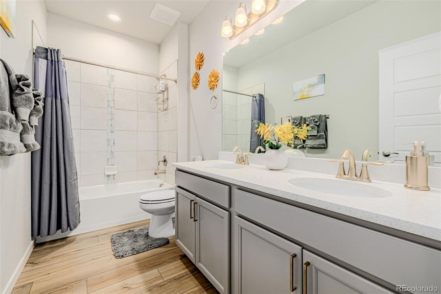 Second Bathroom with tub/shower combo, quartz counters and tile accents Second Bathroom with tub/shower combo, quartz counters and tile accents