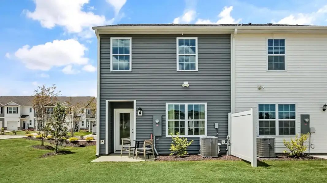 Exterior details and patio area of a home in The Townes at Prestleigh, Wake Forest (Image 3). Exterior details and patio area of a home in The Townes at Prestleigh, Wake Forest (Image 3).