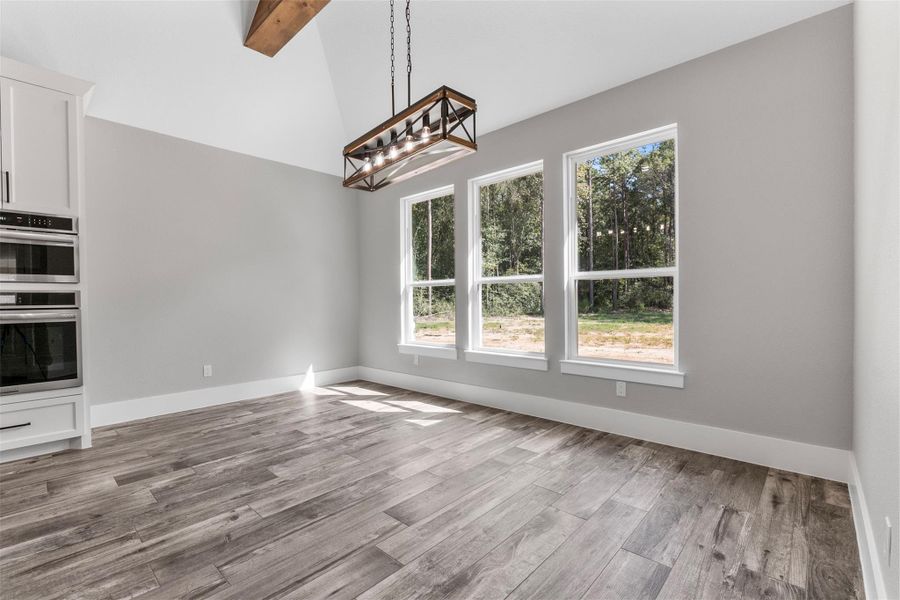 Bright dining area with large windows offering scenic views.