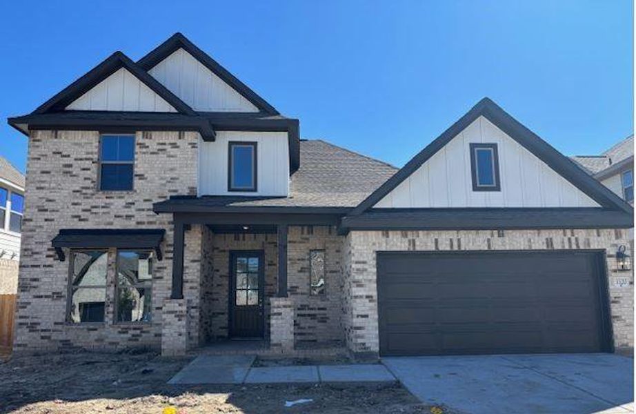 Front exterior of a new home in The Meadows at Imperial Oaks 60', Conroe, TX, highlighting curb appeal (Image 2). Front exterior of a new home in The Meadows at Imperial Oaks 60', Conroe, TX, highlighting curb appeal (Image 2).