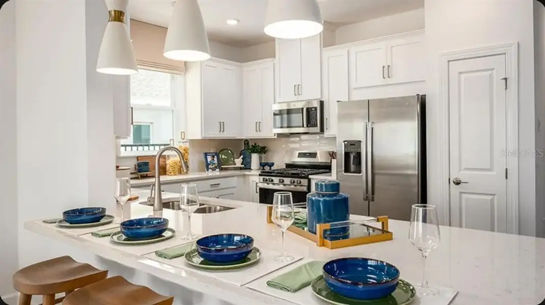 Furnished interior view inside a new home in Esplanade at McKinnon Groves, Winter Garden (Image 10).