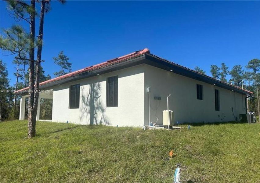 Front exterior of a new home in , Lehigh Acres, FL, highlighting curb appeal (Image 2). Front exterior of a new home in , Lehigh Acres, FL, highlighting curb appeal (Image 2).