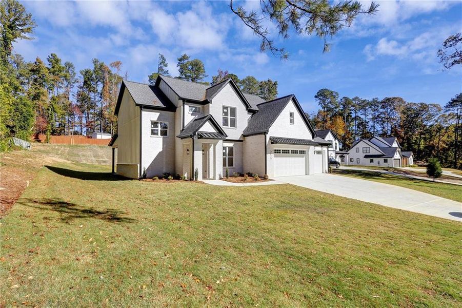 Front exterior of a new home in , Snellville, GA, highlighting curb appeal (Image 2). Front exterior of a new home in , Snellville, GA, highlighting curb appeal (Image 2).
