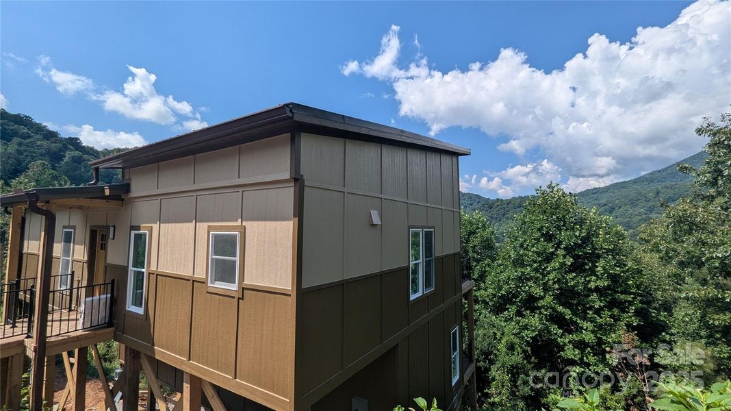 Front exterior of a new home in , Waynesville, NC, highlighting curb appeal (Image 13).