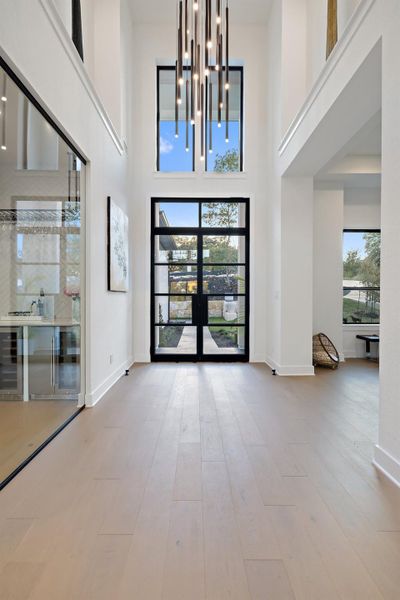 Dramatic Entry showcases a glass enclosed wine room