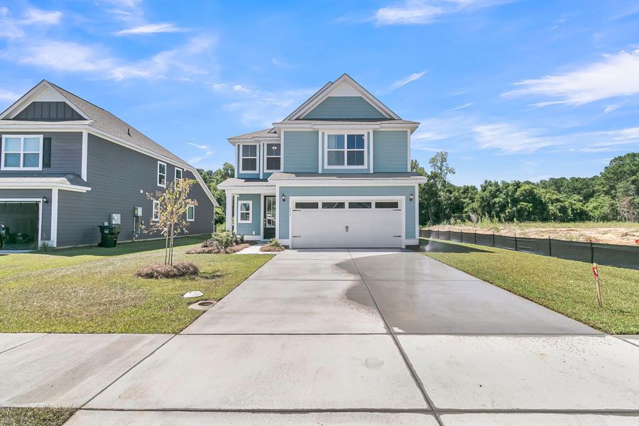 Front exterior of a new home in Abbey Walk, Moncks Corner, SC, highlighting curb appeal (Image 22). Front exterior of a new home in Abbey Walk, Moncks Corner, SC, highlighting curb appeal (Image 22).