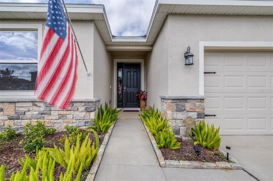 Exterior details and patio area of a home in Farm at Varrea, Plant City (Image 4).