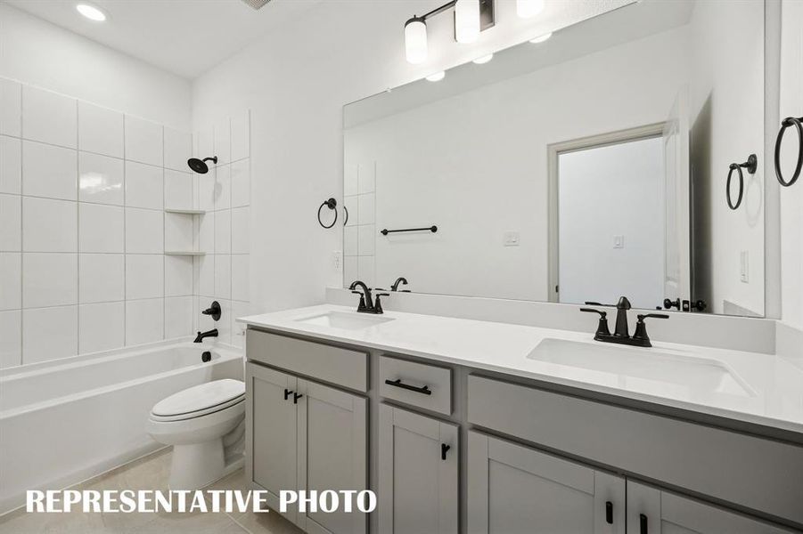 With vanity space for two, friends and family will feel right at home in this guest bath.  REPRESENTATIVE PHOTO