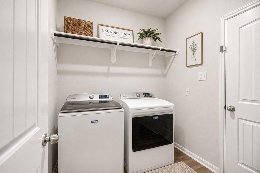 Bright and efficient laundry room featuring modern appliances, open shelving for storage. (washer/dryer can stay if you prefer.)
