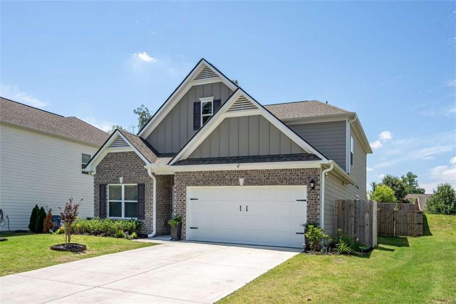 Front exterior of a new home in , Rome, GA, highlighting curb appeal (Image 1). Front exterior of a new home in , Rome, GA, highlighting curb appeal (Image 1).