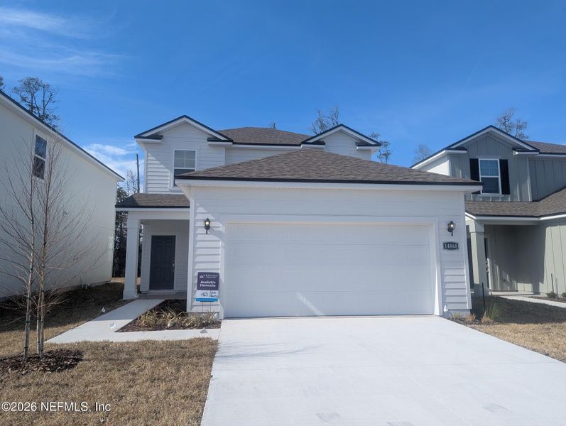 Front exterior of a new home in The Landings at Pecan Park, Jacksonville, FL, highlighting curb appeal (Image 1). Front exterior of a new home in The Landings at Pecan Park, Jacksonville, FL, highlighting curb appeal (Image 1).