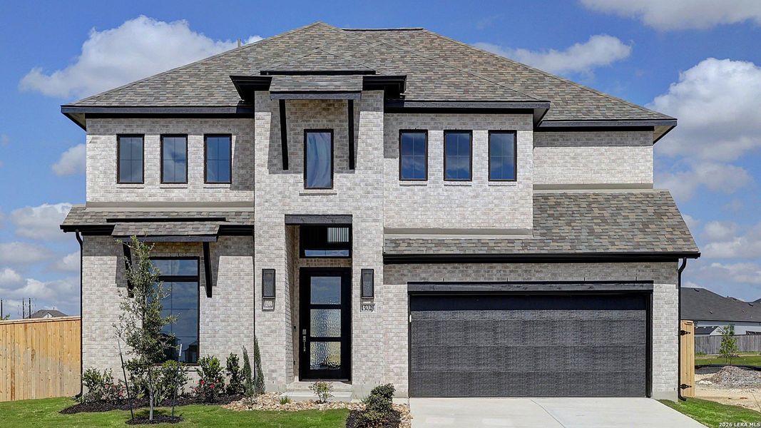 Front exterior of a new home in Ladera, San Antonio, TX, highlighting curb appeal (Image 2). Front exterior of a new home in Ladera, San Antonio, TX, highlighting curb appeal (Image 2).