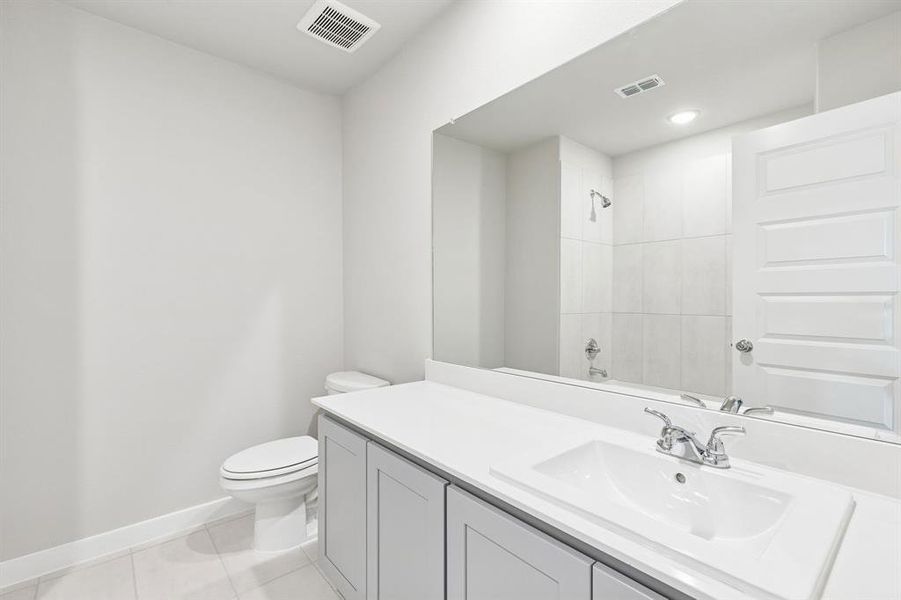 Bathroom in the Haylee home plan by Trophy Signature Homes - REPRESENTATIVE PHOTO