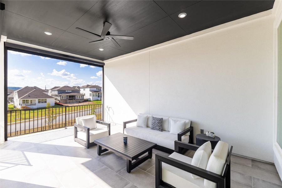 View of patio with a ceiling fan, a residential view, and an outdoor hangout area