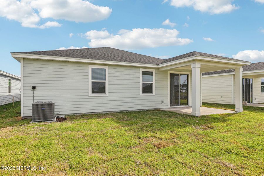 Exterior details and patio area of a home in Cypress Meadows - Signature Series, Jacksonville (Image 3).
