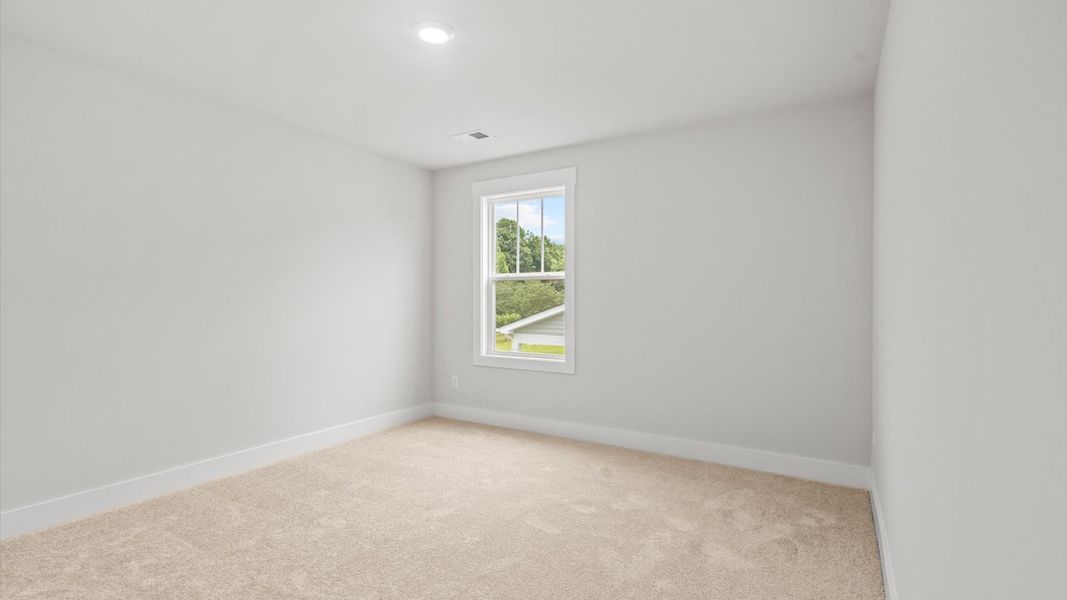 Representative furnished interior of a home built from the Neroli by DRB Homes in Harrier Point, Woodruff (Image 11).