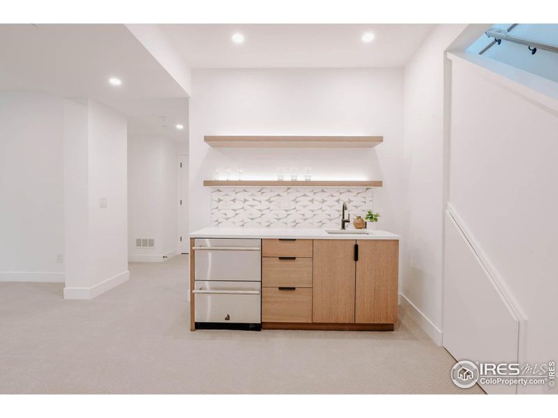 Wet bar with refrigerator and ice maker/freezer drawers