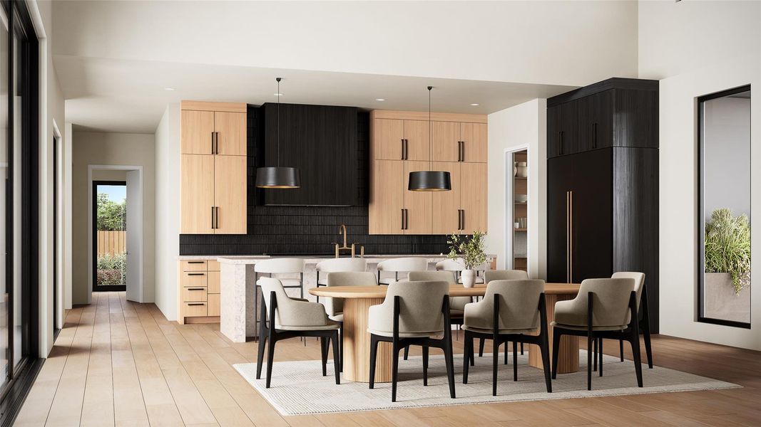 Open-concept kitchen and dining area featuring light wood-finish cabinetry, a contrasting black tile backsplash, and a built-in black refrigerator Open-concept kitchen and dining area featuring light wood-finish cabinetry, a contrasting black tile backsplash, and a built-in black refrigerator
