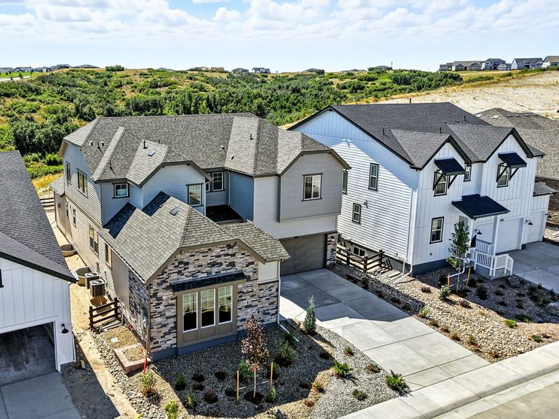 Front exterior of a new home in Macanta, Castle Rock, CO, highlighting curb appeal (Image 2). Front exterior of a new home in Macanta, Castle Rock, CO, highlighting curb appeal (Image 2).