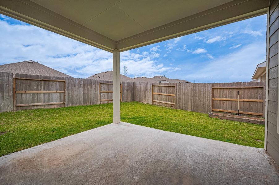 Exterior details and patio area of a home in Sunterra, Katy (Image 30).