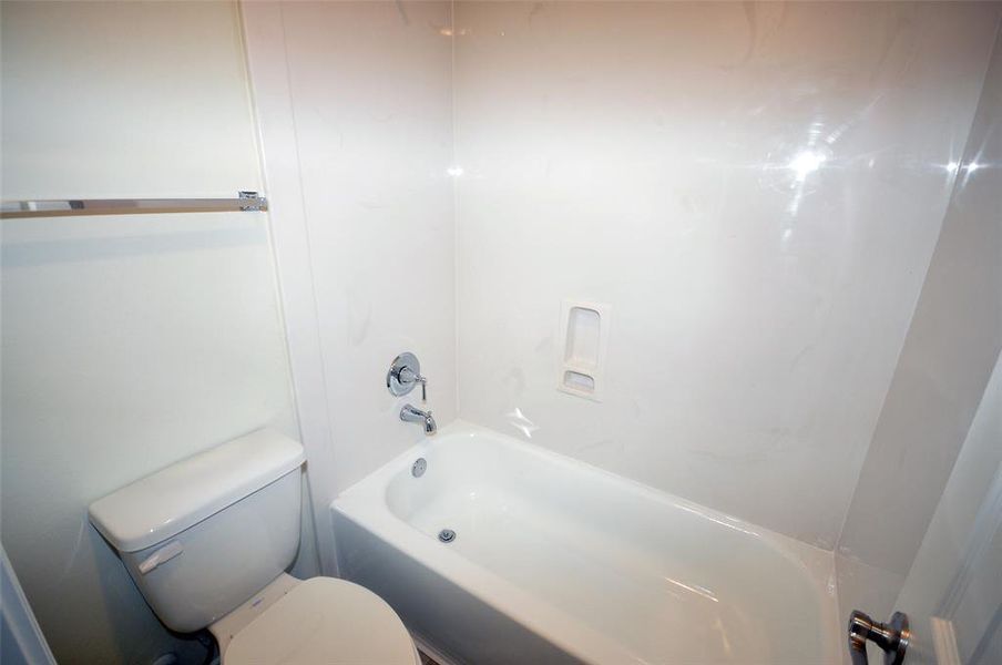 Private commode and tub in the secondary bath.