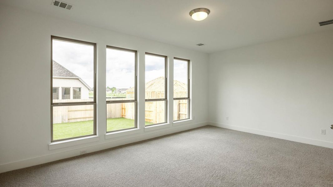 Unfurnished room featuring carpet flooring and baseboards Unfurnished room featuring carpet flooring and baseboards