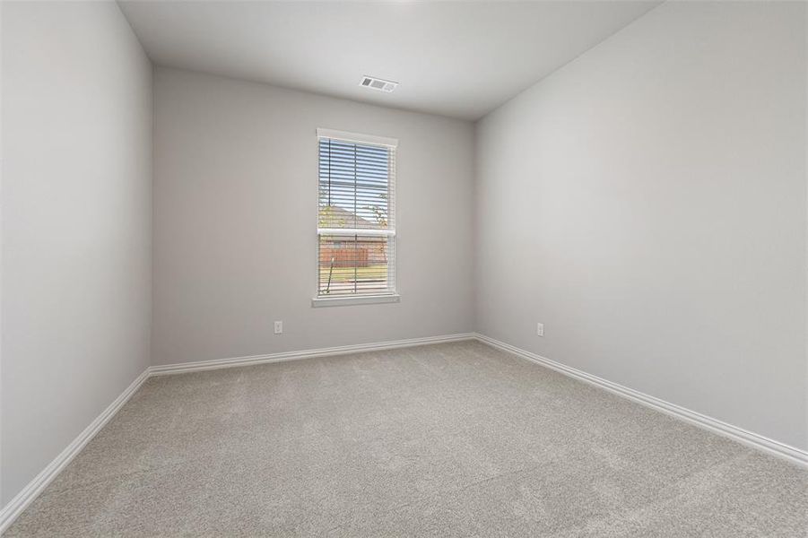 Unfurnished room featuring light colored carpet and baseboards Unfurnished room featuring light colored carpet and baseboards