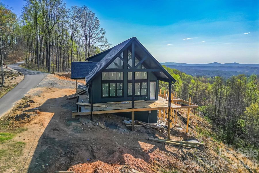 Side elevation with long range mountain views Side elevation with long range mountain views