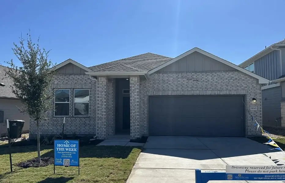 Front exterior of a new home in Porter Country, Buda, TX, highlighting curb appeal (Image 1).