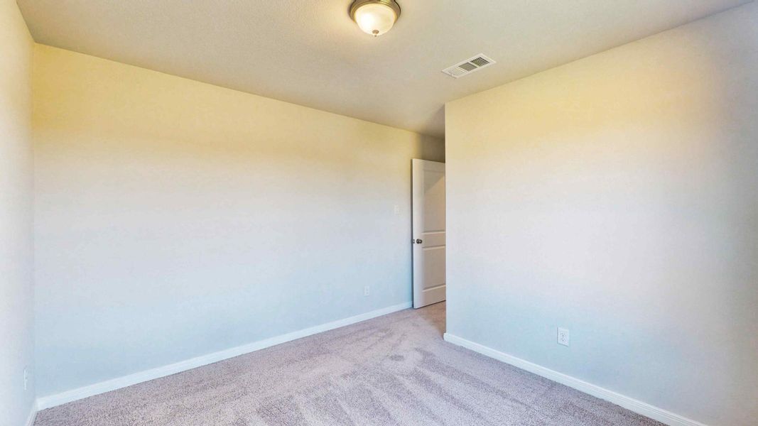A hallway with a light on the ceiling.