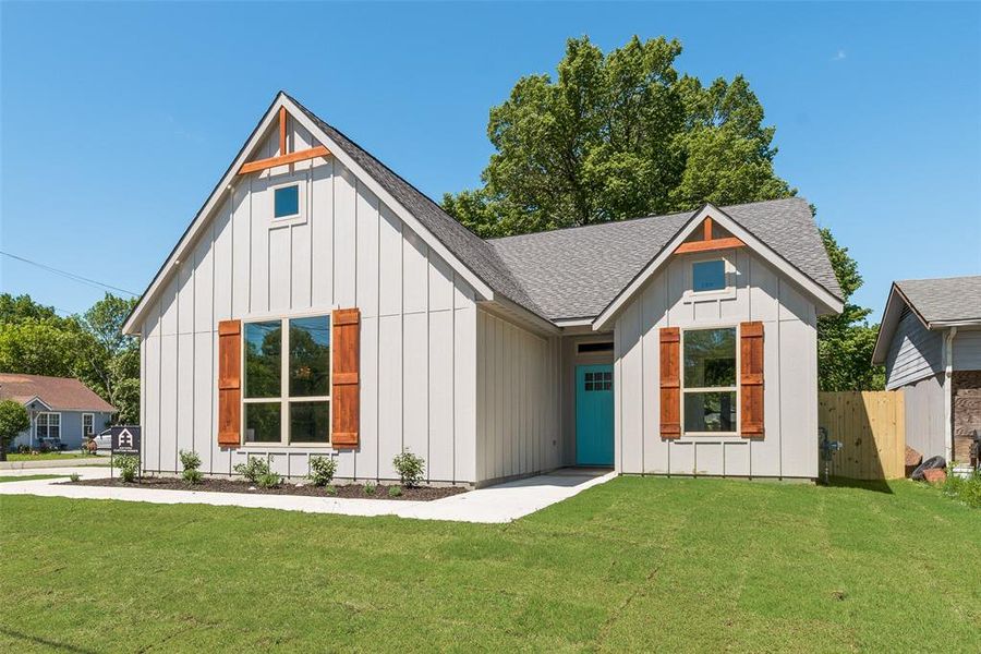 Front exterior of a new home in , Greenville, TX, highlighting curb appeal (Image 2). Front exterior of a new home in , Greenville, TX, highlighting curb appeal (Image 2).