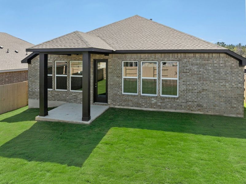 Exterior details and patio area of a home in The Colony, Bastrop (Image 26).