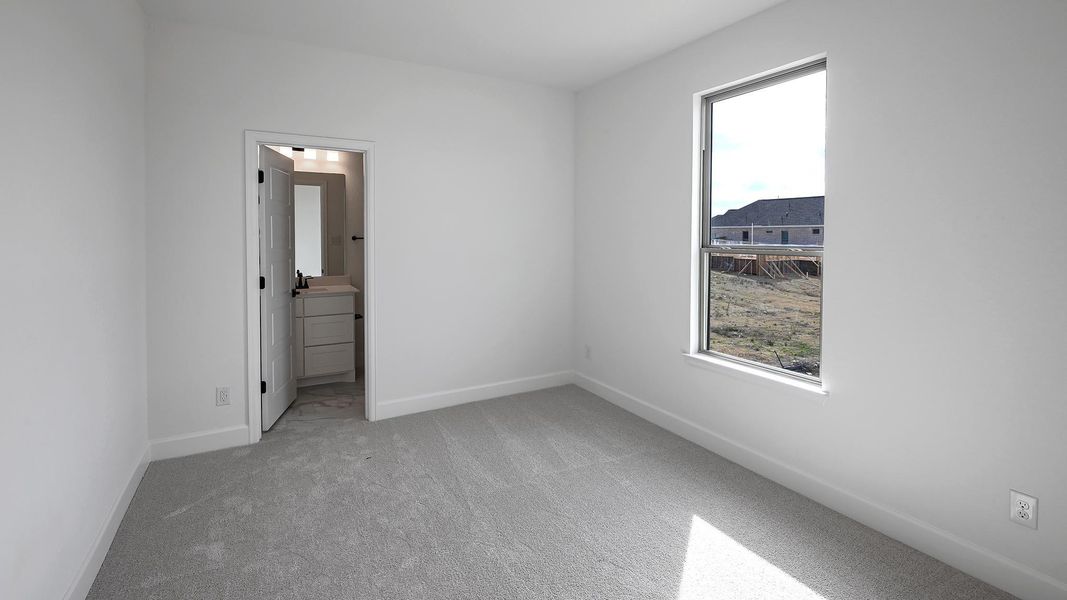 Spacious, unfurnished interior of a new home in 6 Creeks, Kyle (Image 15).