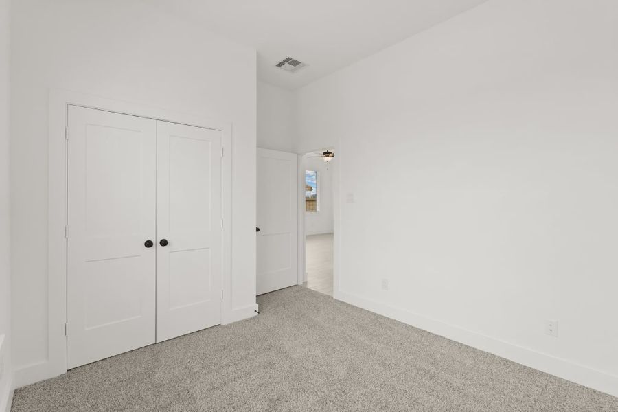 Representative unfurnished interior of a home built from the Pinehurst by Chesmar Homes in Riceland Alley Loads, Mont Belvieu (Image 15).