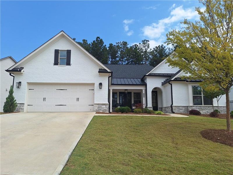 Front exterior of a new home in Soleil Belmont Park, Canton, GA, highlighting curb appeal (Image 1).