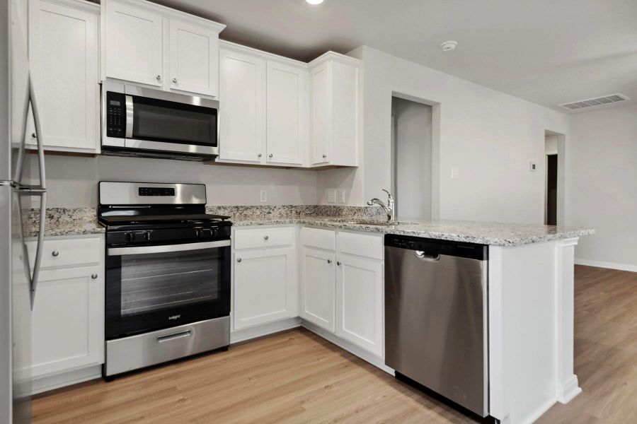 Furnished interior view inside a new home in Sweetwater Ridge, Conroe (Image 4).