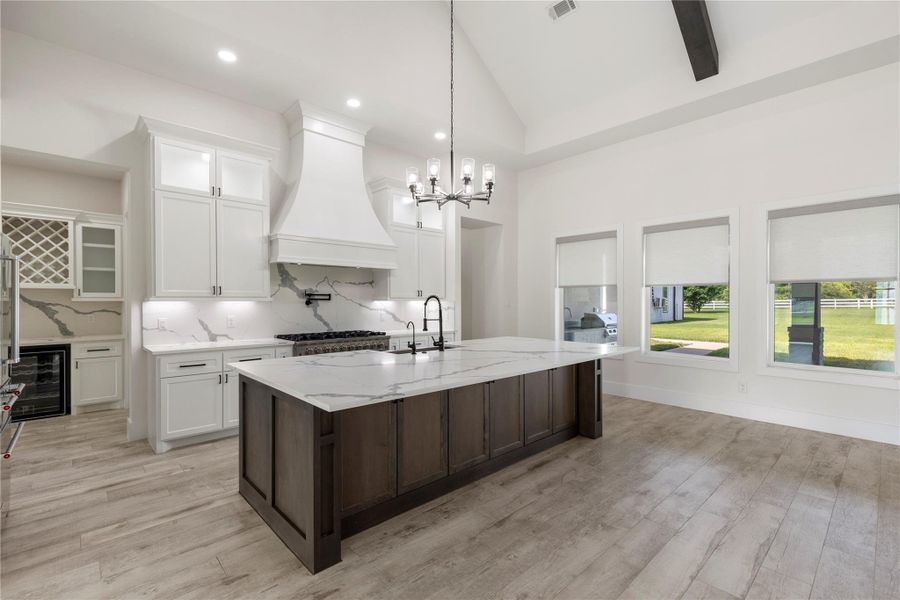 A view of the kitchen that also shows of your butler's pantry with wine fridge, storage for your wine bottles and cabinets to tuck things away when not in use. A view of the kitchen that also shows of your butler's pantry with wine fridge, storage for your wine bottles and cabinets to tuck things away when not in use.
